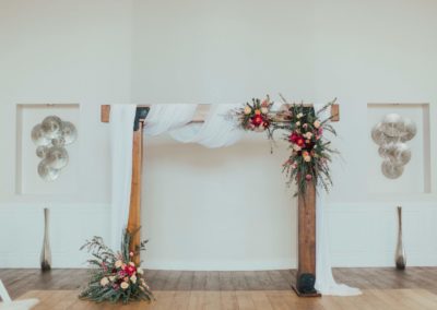 The rustic elegant wood beam wedding arch rental used for a bridal showcase in Gilbert AZ 2019