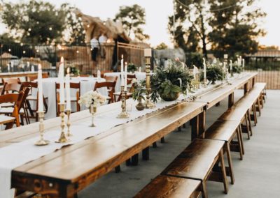 All the backyard wedding rentals you could need! Farm Tables, Bistro Lighting, and a dance floor!