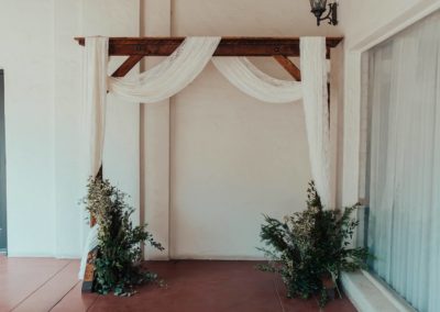 Wood Wedding Arch Rental decorated and set up for a wedding ceremony in Mesa AZ