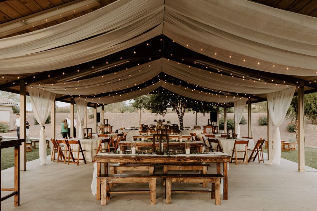 String lighting used to provide light and mood under an outdoor patio at an Arizona wedding reception.