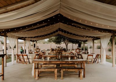 String lighting used to provide light and mood under an outdoor patio at an Arizona wedding reception.