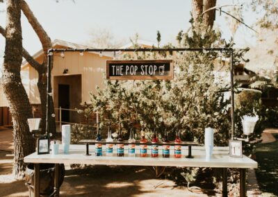 The Soda Bar with Italian Soda Flavors and decor at a backyard wedding in Arizona