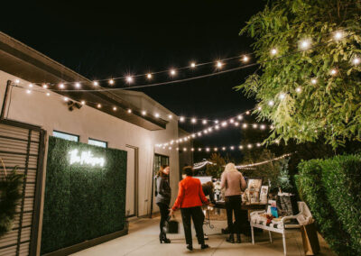 lights strung over an outdoor backyard wedding