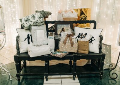 black bench with wedding gifts and cards