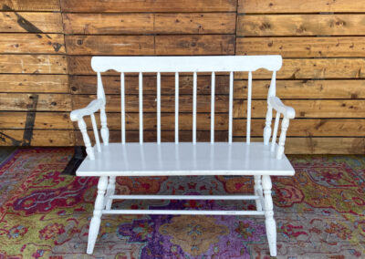 small white bench with arm rests