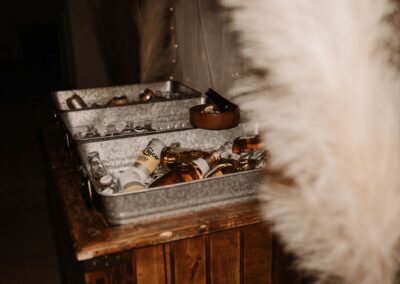 Three galvanized drink tubs holding bottled drinks