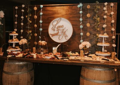 food buffet set up on a wine barrel table