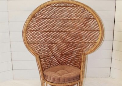 wicker peacock chair with mauve cushion