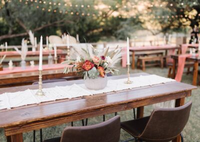 wood table with leather barstools and terracotta pot centerpiece