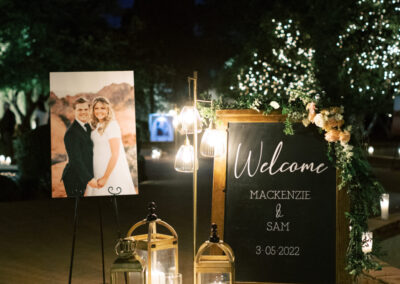 large wood framed chalkboard with lanterns and candles