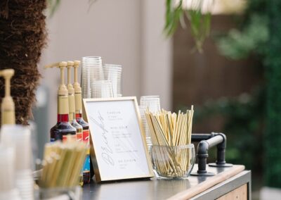 Wood bar with black top and drink mixers on top