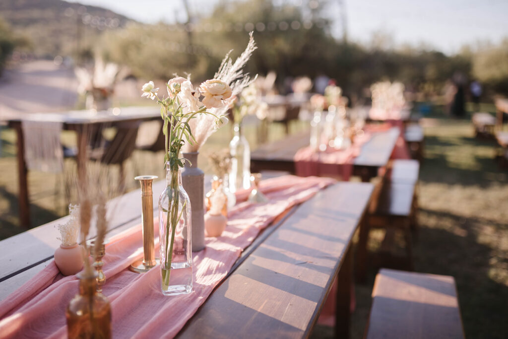 Wood farm table and benches at desert wedding venue