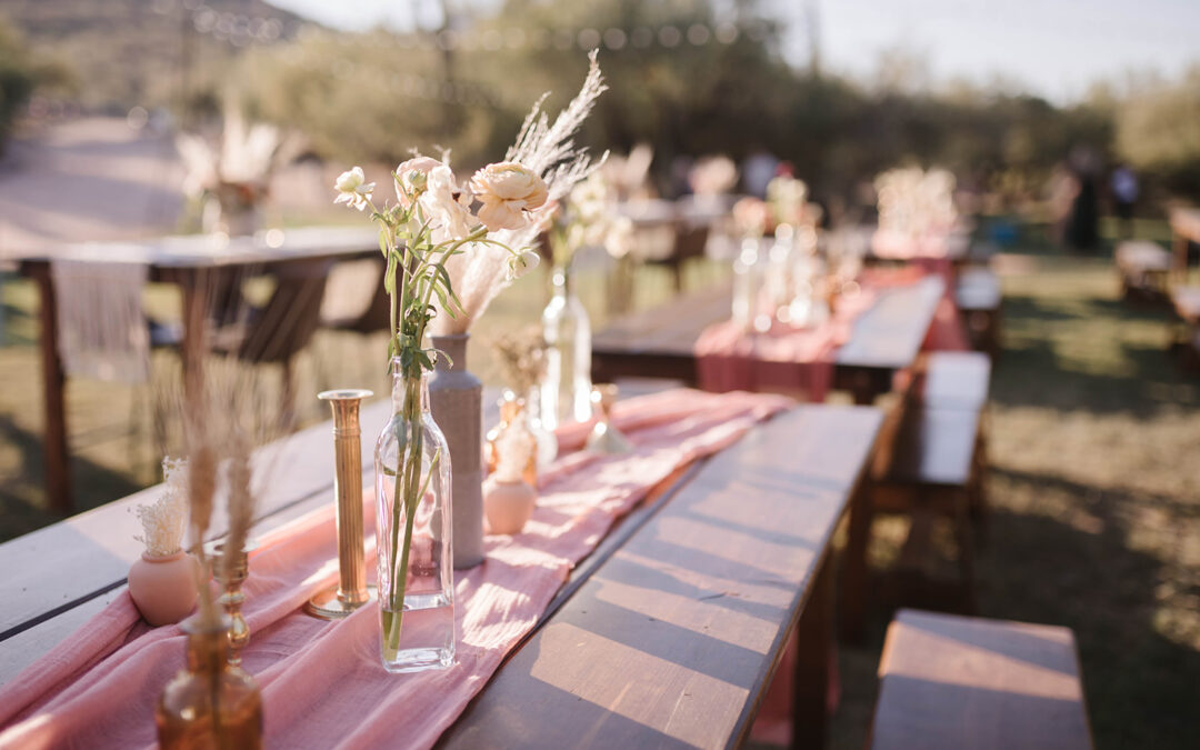Wood farm table and benches at desert wedding venue