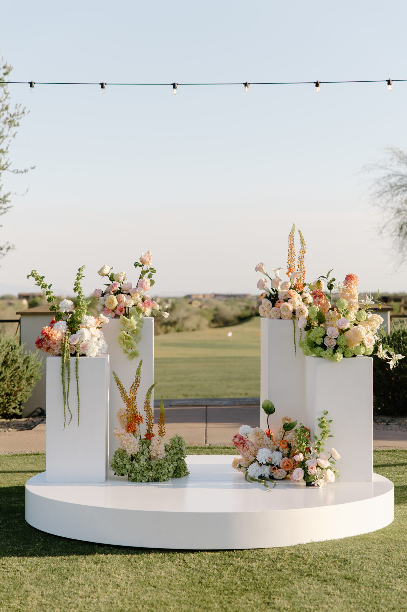 White round stage set for a wedding ceremony at an outdoor arizona wedding venue